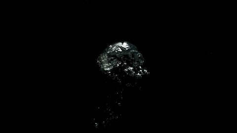 Big Bubbles flowing upwards very slowly from the bottom on a black background from the Submerge collection - Water VFX Video Element.