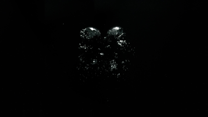 Two big bubbles coming out from the bottom moving upwards on a black background from the Submerge collection - Water VFX Video Element. | Shutterstock HD Video #1057663783