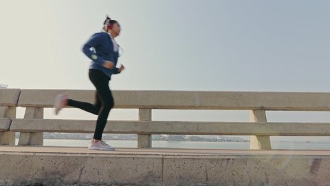 Sport woman jogging on the road in the morning.