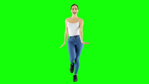 Joyful Woman Wearing White Tank Top And Jeans Walking and Dancing Green Screen