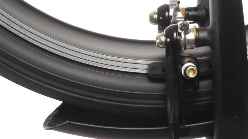 Closeup shots on the breaks of a bicycle stopping the wheel when pressed.