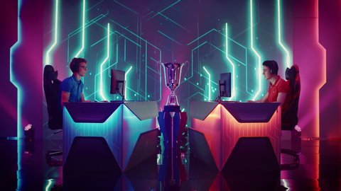 Two Professional Esport Gamers Competition in a Video Game on a Championship Arena, Both Win and Lose Rounds. International Online Cyber Gaming Tournament Live Streaming Event. Zoom in