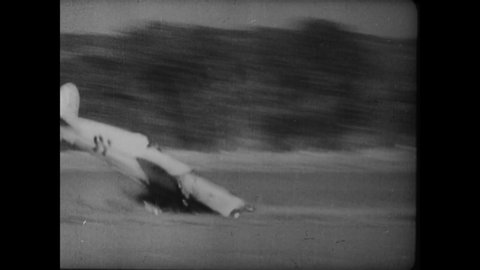 CIRCA 1934 - A plane crashes at the end of the Omaha Air Races in Nebraska, and racecar accidents take place on the Indianapolis Speedway.