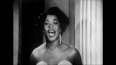 CIRCA 1956 - In this musical revue at the Apollo Theater, Sarah Vaughan concludes a performance of "You're Not the Kind."