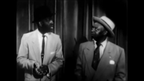 CIRCA 1956 - Comedians Nipsey Russell and Mantan Moreland do a bit together at the Apollo Theater.