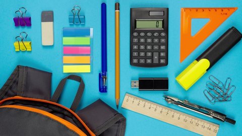 Stop motion animation. Multicolor school supplies are moving from and then to the school backpack on blue background. Back to school concept.
