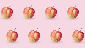 two lines of red fresh apples animated on a pink or pastel background. seamless looping pattern with realistic 3d food. minimal motion design art with fruits - Powered by Shutterstock - Get 15% off with code: PIKWIZARD15