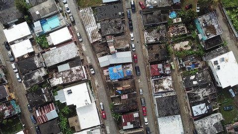 Top Down Aerial View of Puerto Rican Neighborhood and Some Houses Under Reconstruction After Hurricane Disaster