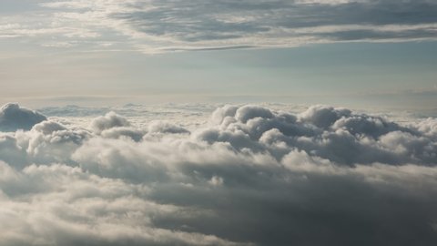 Footage B-roll timelapse foggy or over the clouds while sunrise sky. A sea of fog is formed from stratus. Foggy valley mount ridge nature. Time lapse Beautiful foggy and cloudy slow moving Aerial view