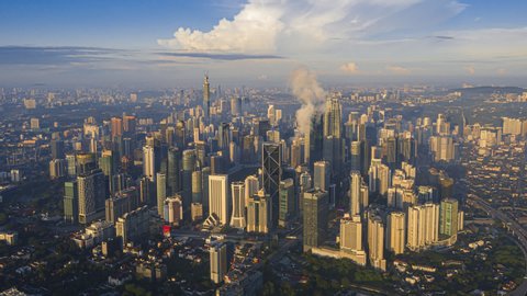 Kuala Lumpur Time lapse: Aerial cityscape view of beautiful blue sky with clouds overlooking KL city skyline in Federal Territory, Malaysia. Prores Full HD