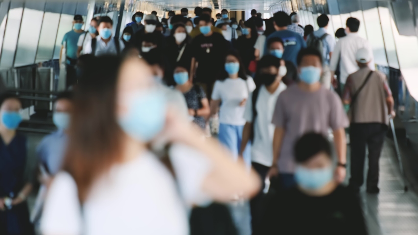 Slow motion of unrecognized people wearing medical face masks in Hong Kong. Covid-19 concept. Royalty-Free Stock Footage #1057706281