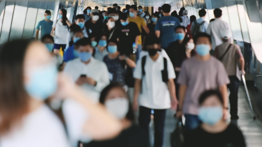 Slow motion of unrecognized people wearing medical face masks in Hong Kong. Covid-19 concept. | Shutterstock HD Video #1057706281