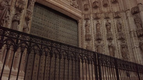 Tilt Up, Seville Cathedral Main Door of Assumption in Spain, Low to High Pan