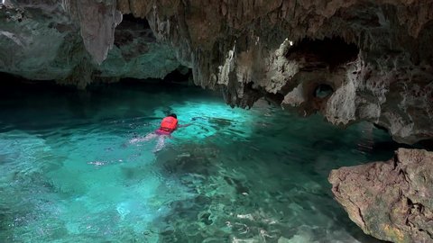 Kantun-Chi Ecopark / Mexico - MARCH 24, 2019:
Tourist is swimming in the Zacil Ha cenote (Clear Water).