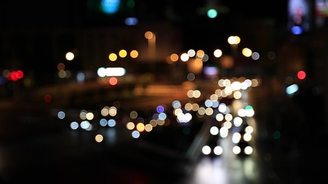 Abstract Bokeh of traffic in big city lights at night. Blurry background of car moving  in bangkok city, Thailand use for transportation background.