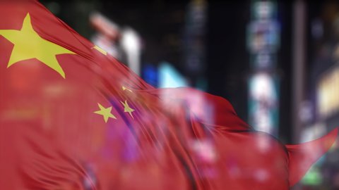 Chinese flag waving with blurred night modern city skyline