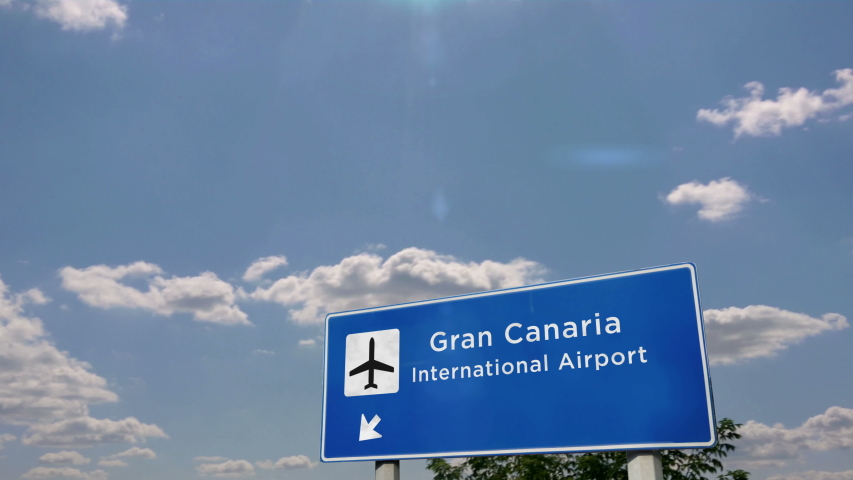 Jet airplane landing in Gran Canaria, Canary, Spain. City arrival with airport direction sign. Travel, business, tourism and transport concept. 3D rendering animation.