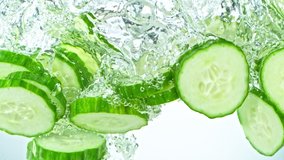 Super Slow Motion Shot of Cucumber Slices Falling into Water on White Background at 1000fps. - Powered by Shutterstock - Get 15% off with code: PIKWIZARD15