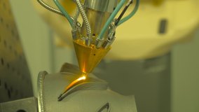Metalworking, robotic, industrial concept. Direct metal deposition - advanced additive laser melting and powder spray manufacturing technology for repair, rebuild metal workpieces - close up - Powered by Shutterstock - Get 15% off with code: PIKWIZARD15