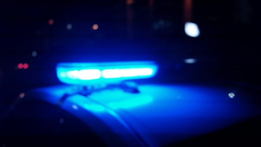 police car flashing lights in the night defocused Royalty-Free Stock Footage #1057758478
