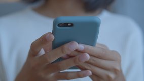 Hand of Asian girl using texting mobile phone or chat. Close up of woman hand - Powered by Shutterstock - Get 15% off with code: PIKWIZARD15