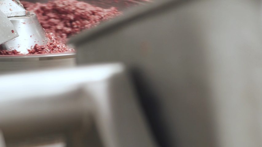 Meat production, the process of making minced pork meat, food production line, mixing minced meat. Royalty-Free Stock Footage #1057759111