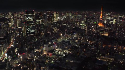 TOKYO, JAPAN : Aerial high angle sunset CITYSCAPE of TOKYO. View of central downtown area around Roppongi. Japanese urban metropolis concept shot. Long time lapse shot sunset to night.