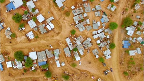Aerial view of houses on red dirt in Lagos, Nigeria.