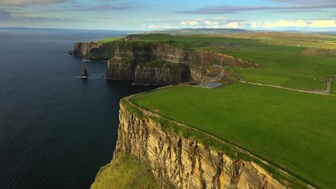 Cliffs of Moher, Clare, Ireland, August 2020, Drone slowly pushes forward towards a spectacular view of the Pinnacle Rock and O'Brien's Tower.