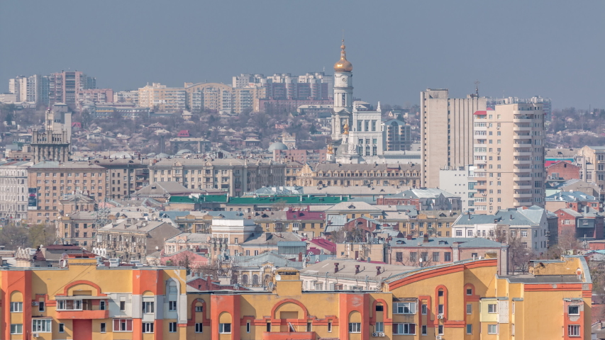 Kharkiv city from above timelapse. View from Defenders of Ukraine square with the bell tower of the Assumption Cathedral (Uspenskiy Sobor) . Aerial view to the city center and residential districts