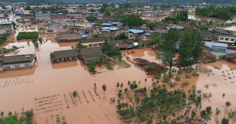 Aerial view of small town been flood Flooded Chinese neighbourhood in Leshan Sichuan China at 2020 Homes, houses overflowing water people walking in the water car driving in flood