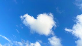  Heart cloud on blue sky. High quality 4k footage