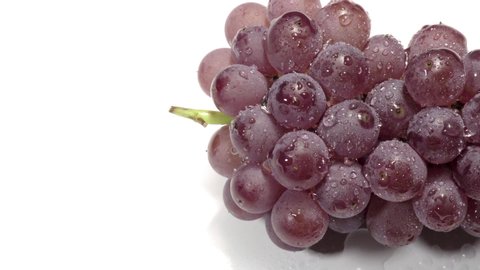 Water droplets on the seedless grape "Delaware".Shot on a white background.