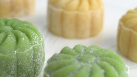 Making colorful snow skin moon cake, recipe of sweet snowy mooncake, traditional savory dessert for Mid-Autumn Festival, close up, lifestyle.