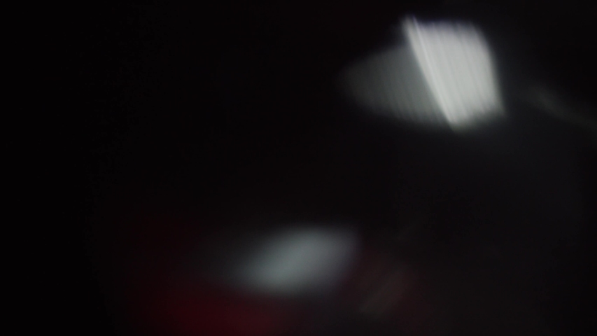 Optical lens flare, Light Leak, Studio Flare, flash lights, natural lighting lamp rays effect, Light Horizon, Light pulses and glow, beautiful light leak on dark background with Real lens flare. | Shutterstock HD Video #1057778266