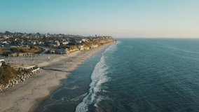 Warm and sunny day at the beautiful moonlight beach in southern California - 4k drone shot of Encinitas near San Diego