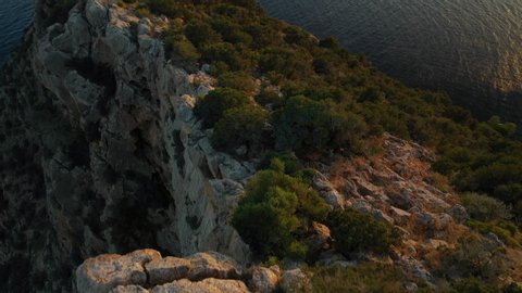 Aerial video of the island of Es Vedrà during sunset. Off the coast of Ibiza.