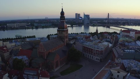 Riga, Latvia. August 10, 2020. Beautiful aerial panorama of Riga center during amazing sunset. View of illuminated Riga city, capital of Latvia.