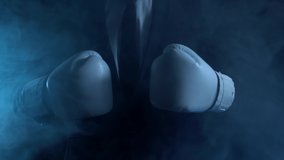 A businessman in Boxing gloves. Willingness to fight with difficulties - Powered by Shutterstock - Get 15% off with code: PIKWIZARD15