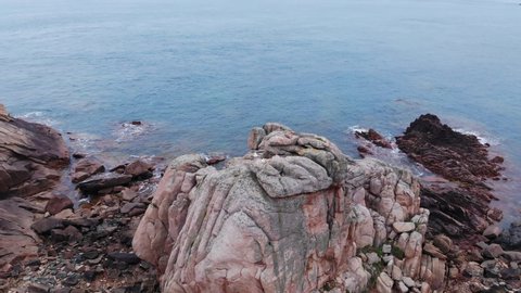 touristic aerial drone shot of seagull on rose granit, The Côte de granit rose or Pink Granite Coast is a stretch of coastline in the Côtes d'Armor Romantic touristic French holiday travel in France
