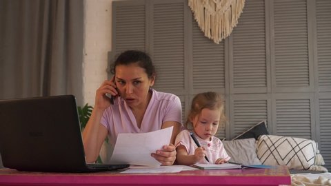 Mom working remotely. Multitasking for Work-at-Home woman. Stressful work, stressed mother and capricious child. Remote job, freelance, home business. Freelancing and consulting. Consult or Freelance