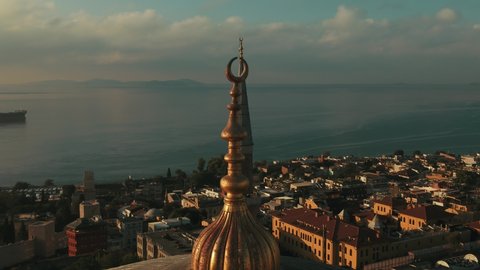Crescent in Hagia Sophia mosque dome close-up and istanbul seascape
