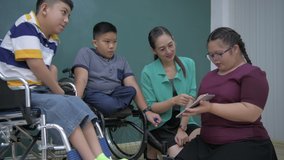 Education concept. Children with disabilities are presenting information with a tablet. 4k Resolution. - Powered by Shutterstock - Get 15% off with code: PIKWIZARD15