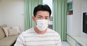 Telemedicine concept - asian young male patient wears facial mask and describe his health condition to the doctor