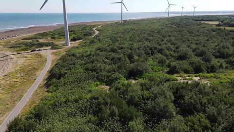 Drone shot aerial view of wind turbine on the coastal and seashore of Taiwan