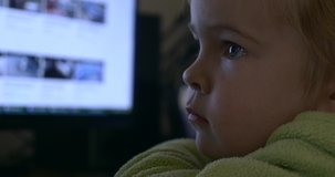 Real Child True Emotions. Natural Face Expressions while Cute Little Boy Watches Videos on Computer Monitor Screen