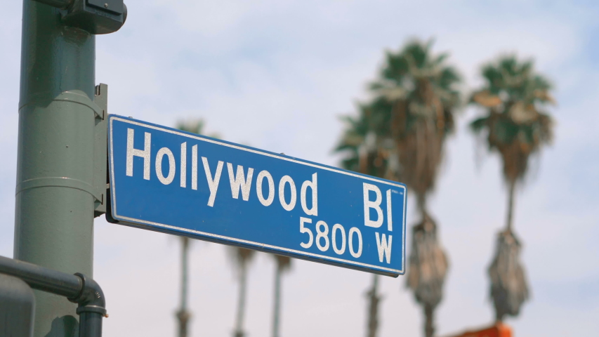 Hollywood boulevard street sign and traffic lights in 4k slow motion 60fps