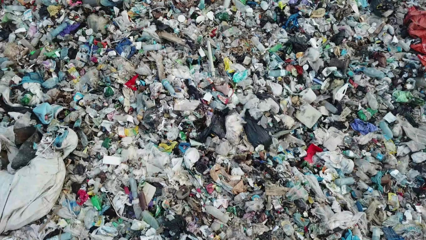 Garbage on the ocean beach. Empty used dirty plastic bottles. Dirty sea sandy coast. Environmental pollution. Environmental problem. | Shutterstock HD Video #1057898278
