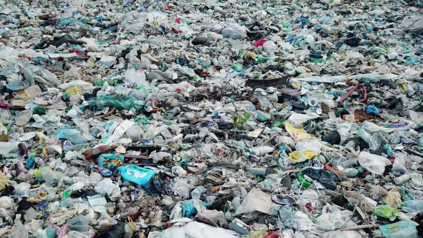Garbage on the ocean beach. Empty used dirty plastic bottles. Dirty sea sandy coast. Environmental pollution. Environmental problem. | Shutterstock HD Video #1057898281