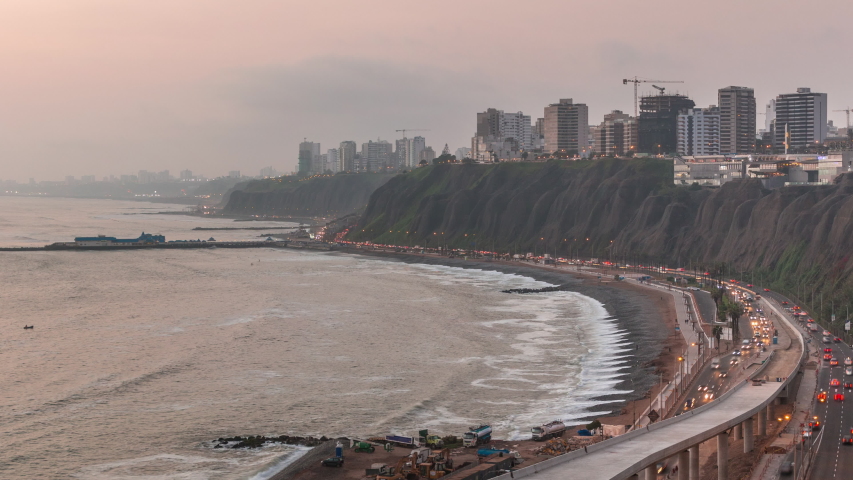 Aerial view of Lima's Coastline in the neighborhood of Miraflores day to night transition timelapse, Lima, Peru. Road traffic with junction and beach with ocean from Husares De Junin waterfront | Shutterstock HD Video #1057902301